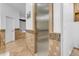 Modern walk-in shower with glass door and tiled surround in the bathroom at 21470 E Orchard Ln, Queen Creek, AZ 85142