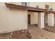 Exterior view of tan home with a tile roof, including walkway and front door with security screen at 2201 W Union Hills Dr # 119, Phoenix, AZ 85027