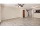 Open-concept living room featuring sleek tile floors and staircase leading to the second level at 2201 W Union Hills Dr # 119, Phoenix, AZ 85027