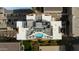 Aerial view of a building rooftop featuring a pool, lounge area, and stylish outdoor seating at 2211 E Camelback Rd # 402, Phoenix, AZ 85016