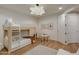 ' bedroom featuring a bunk bed, small table and chairs, and light colored wood floors at 2211 E Camelback Rd # 402, Phoenix, AZ 85016