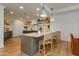 Open kitchen with island, pendant lighting, and modern appliances at 2211 E Camelback Rd # 402, Phoenix, AZ 85016