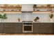 Modern kitchen with stainless steel appliances and floating shelves at 2211 E Camelback Rd # 402, Phoenix, AZ 85016
