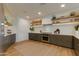 Contemporary kitchen featuring sleek cabinetry and wood flooring at 2211 E Camelback Rd # 402, Phoenix, AZ 85016