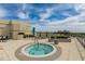 Rooftop deck with a hot tub, lounge chairs, and an umbrella. Great space for enjoying the view at 2211 E Camelback Rd # 402, Phoenix, AZ 85016