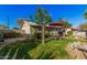 Cozy backyard featuring well-maintained lawn and outdoor seating, great for relaxation at 2306 E Burgess Ln, Phoenix, AZ 85042
