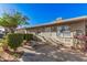 View of the home's backyard with a small patio area and some landscaping features at 2306 E Burgess Ln, Phoenix, AZ 85042