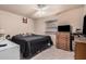 Cozy bedroom with ample closet space, comfortable bed, and relaxing ambiance at 2306 E Burgess Ln, Phoenix, AZ 85042