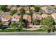 Overhead view showcases a beautiful home in a well-maintained neighborhood with mature trees at 2313 E Gondola Ln, Gilbert, AZ 85234