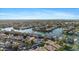 Expansive aerial view of a residential community featuring waterfront homes and lush landscaping near a tranquil lake at 2313 E Gondola Ln, Gilbert, AZ 85234