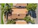 Aerial view of a well-maintained home with a red tile roof and beautiful landscaping at 2313 E Gondola Ln, Gilbert, AZ 85234