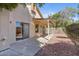 Backyard featuring covered patio and desert landscaping, perfect for outdoor relaxation at 2313 E Gondola Ln, Gilbert, AZ 85234