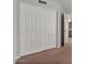 Bedroom with a large closet featuring white doors and traditional design at 2313 E Gondola Ln, Gilbert, AZ 85234