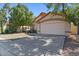 Well-maintained single-story home featuring a two-car garage and manicured lawn at 2313 E Gondola Ln, Gilbert, AZ 85234