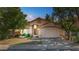 Charming single-story home with a two-car garage and lush landscaping at 2313 E Gondola Ln, Gilbert, AZ 85234
