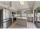 Modern kitchen featuring stainless steel appliances and gray cabinets at 2313 E Gondola Ln, Gilbert, AZ 85234