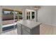 Kitchen island with stainless steel appliances and sliding door view to backyard at 2313 E Gondola Ln, Gilbert, AZ 85234