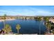 Scenic lake view surrounded by palm trees and waterfront homes, offering a serene and picturesque community setting at 2313 E Gondola Ln, Gilbert, AZ 85234