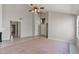 Open-concept living room featuring tile flooring, vaulted ceilings, and fireplace at 2313 E Gondola Ln, Gilbert, AZ 85234