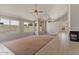 Bright living room boasting tile floors, vaulted ceilings, a fireplace, and lots of natural light at 2313 E Gondola Ln, Gilbert, AZ 85234