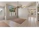 Bright living room with large windows, neutral walls, and open access to other rooms at 2313 E Gondola Ln, Gilbert, AZ 85234