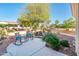 Landscaped backyard with a water feature and additional seating, great for relaxing at 23216 N Gaviota Dr, Sun City West, AZ 85375