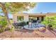 Backyard featuring seating and an artificial water feature, viewed from the yard at 23216 N Gaviota Dr, Sun City West, AZ 85375