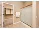 Modern bathroom with glass enclosed shower and access to the primary bedroom closet at 23216 N Gaviota Dr, Sun City West, AZ 85375