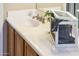Bathroom sink with oak vanity cabinet, white countertop, and brushed nickel faucet at 23216 N Gaviota Dr, Sun City West, AZ 85375
