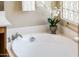 Close up of a white bathtub featuring white orchid decoration at 23216 N Gaviota Dr, Sun City West, AZ 85375
