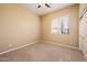 Spare bedroom with neutral tones, carpeted flooring, and a window for natural lighting at 23216 N Gaviota Dr, Sun City West, AZ 85375