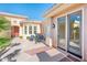 Private courtyard with space for seating, a covered patio and access to home through french doors at 23216 N Gaviota Dr, Sun City West, AZ 85375