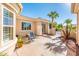 Private courtyard seating area with covered patio, ample natural light, and desert landscaping at 23216 N Gaviota Dr, Sun City West, AZ 85375