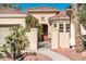 Charming entrance with a courtyard featuring desert landscaping and a secure gated entry for added privacy at 23216 N Gaviota Dr, Sun City West, AZ 85375
