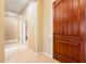 Entryway featuring a wooden front door, tile flooring, and an open walkway at 23216 N Gaviota Dr, Sun City West, AZ 85375