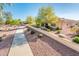 Property exterior featuring a landscaped walkway and tan stucco facade at 23216 N Gaviota Dr, Sun City West, AZ 85375