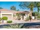 Charming home exterior with a well-kept yard, gated entrance, and a two-car garage, showcasing its curb appeal at 23216 N Gaviota Dr, Sun City West, AZ 85375