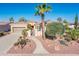 Attractive single-story home with beautiful desert landscaping, sidewalk and private courtyard at 23216 N Gaviota Dr, Sun City West, AZ 85375
