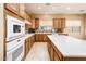 Bright kitchen with modern appliances, ample storage, and a large island perfect for meal preparation and Gathering gatherings at 23216 N Gaviota Dr, Sun City West, AZ 85375