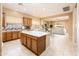 Stylish open kitchen with a central island and seamlessly connects to the Gathering room at 23216 N Gaviota Dr, Sun City West, AZ 85375