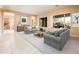 Comfortable living room featuring stylish decor, neutral colors and plenty of natural light at 23216 N Gaviota Dr, Sun City West, AZ 85375