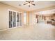Open layout with large windows, shutters and tile floors connecting indoor and outdoor spaces at 23216 N Gaviota Dr, Sun City West, AZ 85375