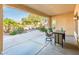 Covered patio featuring a table with barstools, and a view of the backyard landscaping at 23216 N Gaviota Dr, Sun City West, AZ 85375