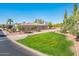 Street view of a well-maintained home with green lawn and desert landscaping for an inviting look at 23216 N Gaviota Dr, Sun City West, AZ 85375