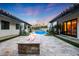 Luxury backyard showcasing a pool, fountain feature, a fire pit, travertine tile, and a red tile roof at 2421 E Montebello Ave, Phoenix, AZ 85016