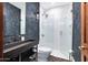 Modern bathroom with unique sink, frameless glass shower, and decorative tile at 2421 E Montebello Ave, Phoenix, AZ 85016
