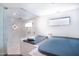Modern bathroom boasts a glass shower, whirlpool tub, and luxurious finishes for a spa-like experience at 2421 E Montebello Ave, Phoenix, AZ 85016