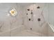 This elegant bathroom features a walk-in shower with tiled walls and floors, and a glass enclosure at 2421 E Montebello Ave, Phoenix, AZ 85016