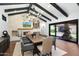 Charming dining room with a stone fireplace, built-in cabinetry, and a view to the outdoor patio at 2421 E Montebello Ave, Phoenix, AZ 85016