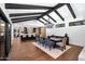 Bright dining room features a modern chandelier and flows seamlessly into the open kitchen area at 2421 E Montebello Ave, Phoenix, AZ 85016